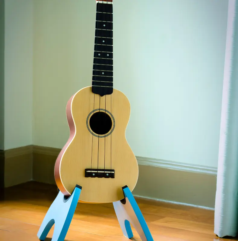 un ukulélé posé sur son support pour pouvoir le prendre et progresser rapidement au ukulélé