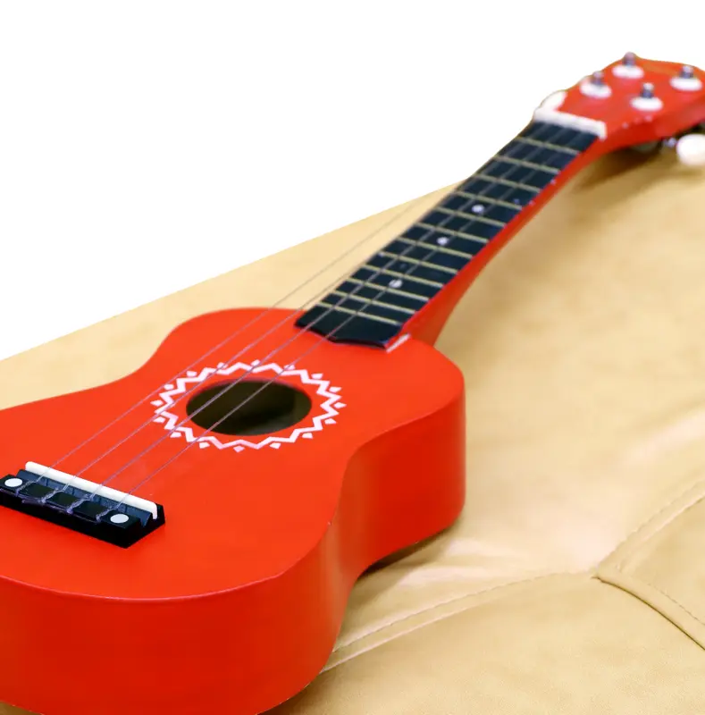 Un joli ukulélé rouge posé pour progresser rapidement au ukulélé.
